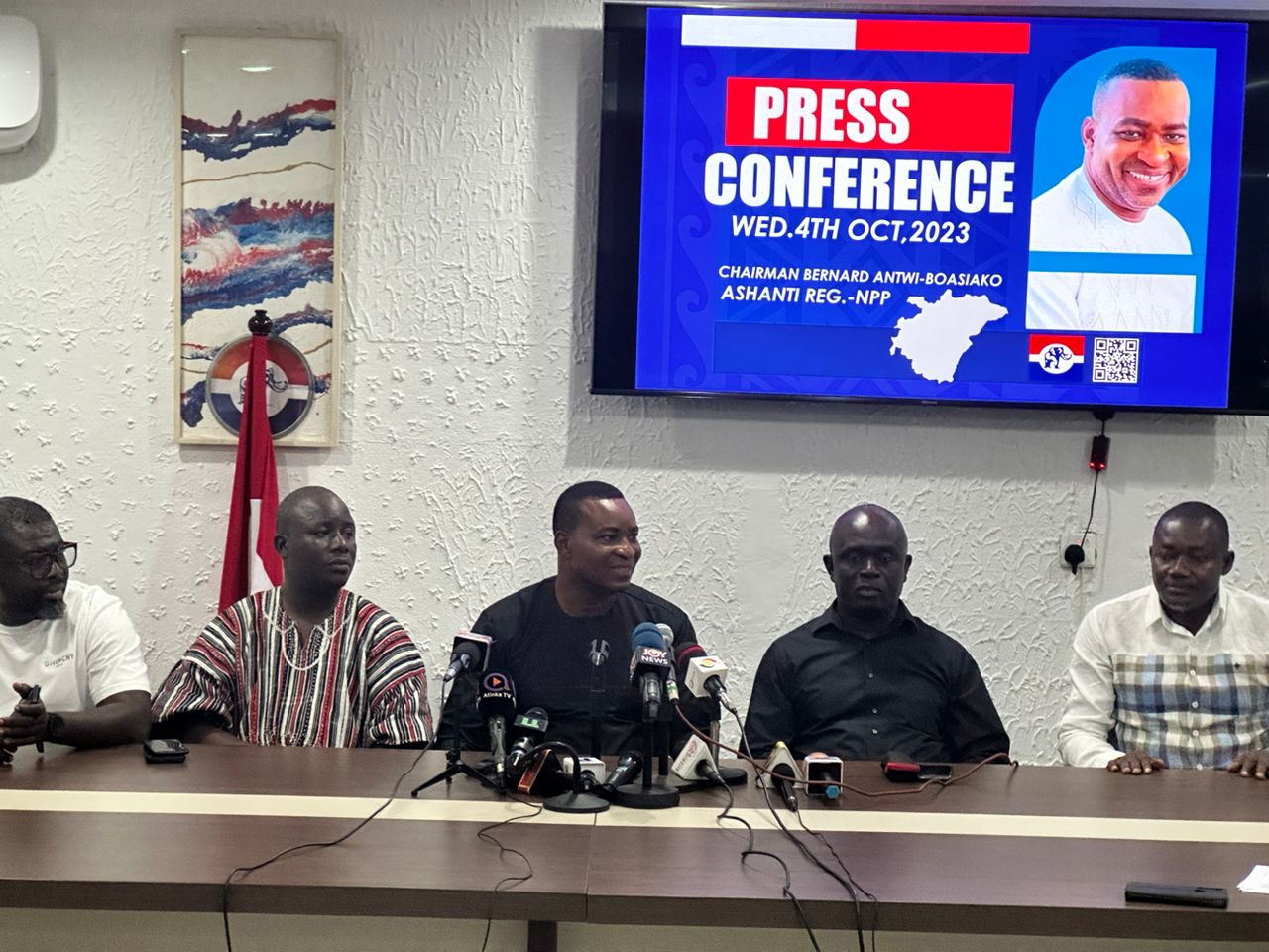 Wontumi (seated in front of microphones) addressing the media at the Campaign of Office of Dr Bawumia in Asokwa
