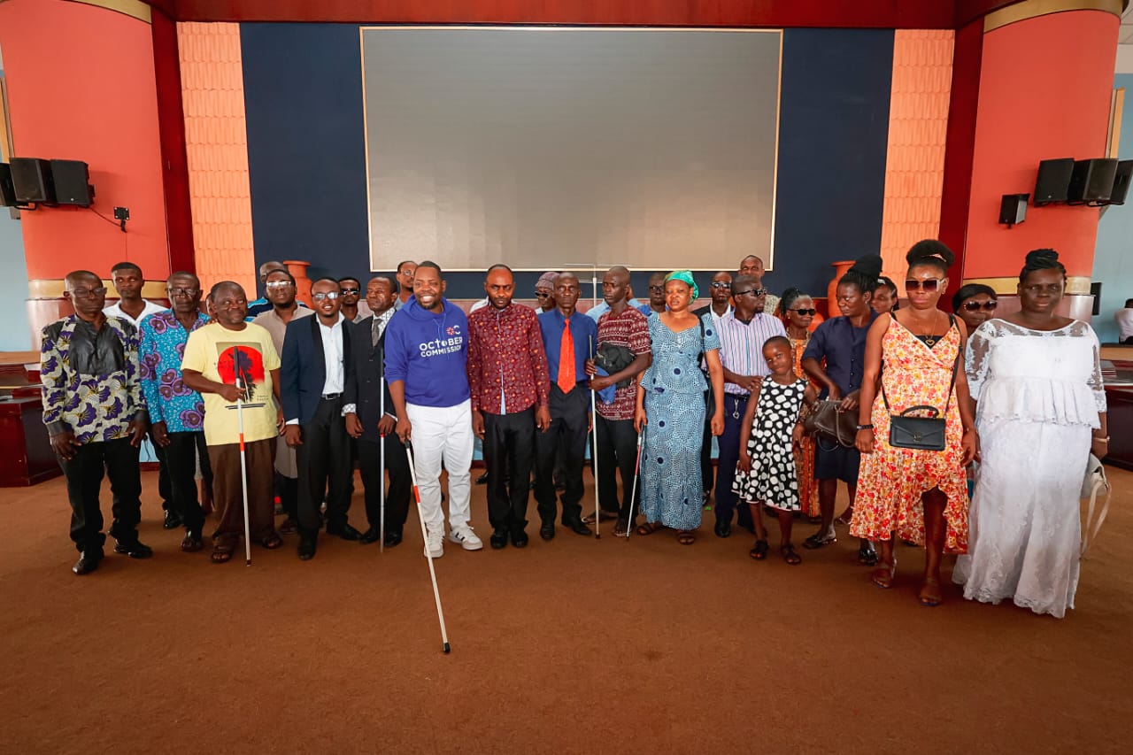 Pastor Joshua Obeng (4th from left) displaying the white cane alongside members of the Ghana Blind Union at the auditorium of CCC on Sunday which marked International White Cane Safety Day.