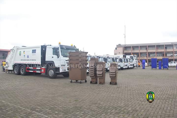 Trucks and pieces of waste containers outdoored for the waste management project