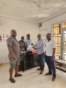 Dr Stephen Amoah (2nd Right) presenting his nomination forms to Mr Michael Essel-Mills, Nhyiaeso NPP Constituency secretary at the Constituency office on Monday.