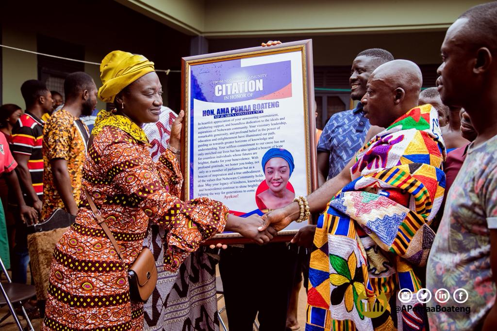 Nana Yaw Kyere III,Nobewamhene presenting the citation to Hon Ama Pomaa Boateng, MP for Juaben Constituency