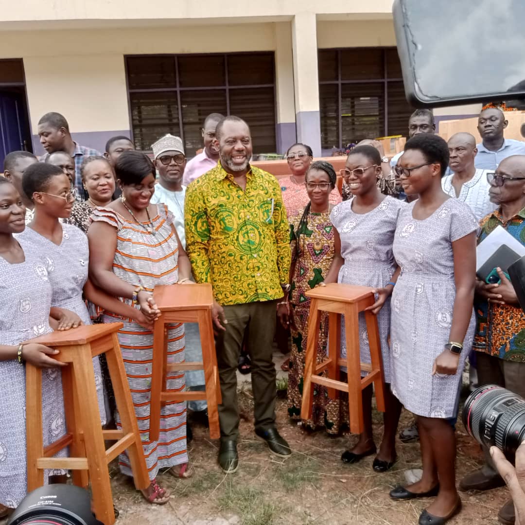 Dr. Mathew Opoku Prempeh with the Headmistress of the school, teachers and some students.